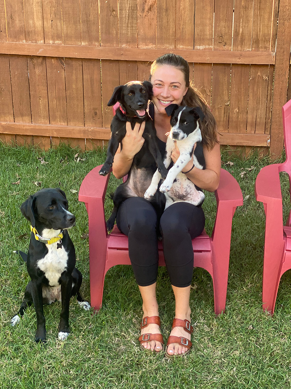 girl-holding-puppies